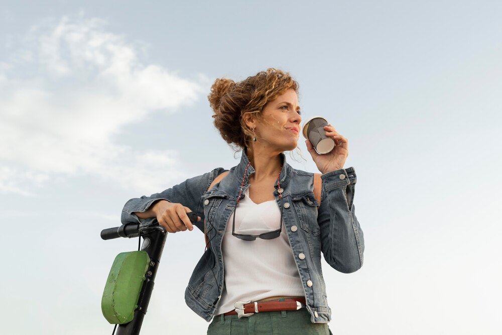 Medium shot woman with scooter