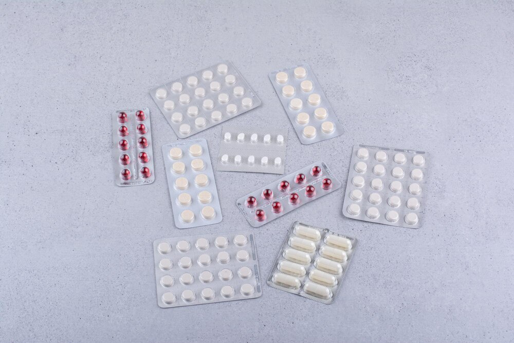 Pile of medical pills on marble background. High quality photo