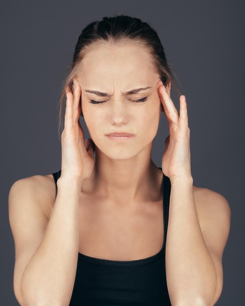 Beautiful woman puts hands on the head