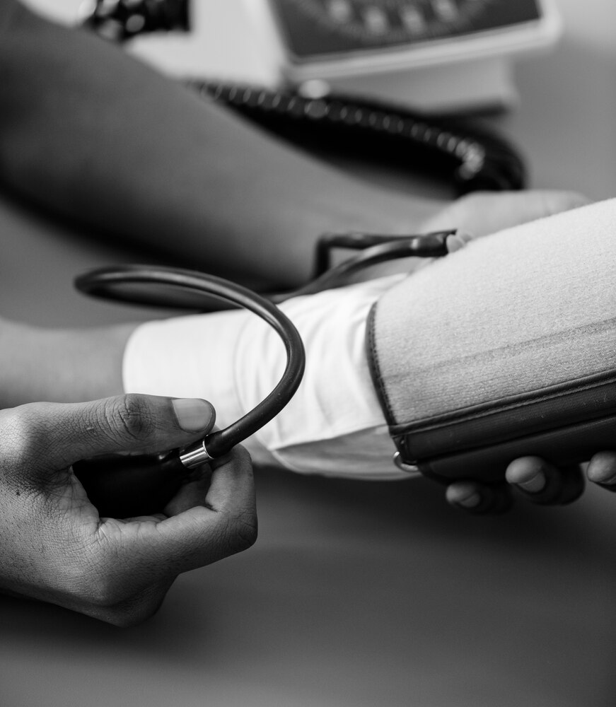 Nurse measuring patient blood pressure